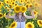 Beautiful young on the field of sunflowers