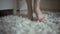 Beautiful young girl bare feet moving on interior in the living room in slow motion.