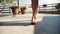 Beautiful young girl bare feet moving outdoor