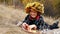 Beautiful young girl with a basket of ripe apples