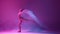 Beautiful young girl in beige bodysuit performing, dancing ballet with transparent veil against gradient pink purple