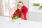 Beautiful young girl eating healthy green peas stressed with hand on head, shocked with shame and surprise face, angry and