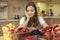 Beautiful young girl eats fruits and fresh berries in the kitchen, The girl dreamed of eating fruit, closed her eyes with pleasure