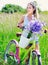 Beautiful young girl with her cruiser bike