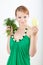 Beautiful young girl holding a Bulgarian pepper an