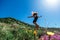 Beautiful, young girl jumps on the slope of a ridge.  Late spring early summer Gelendzhik