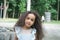 Beautiful Young Girl With Long Curly balck Hair in the park