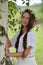 Beautiful young girl with plaits and daisies