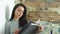 Beautiful young girl reading a glossy magazine