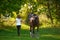 Beautiful young girl rider and her horse