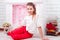 Beautiful young girl sitting near the valentines decorations