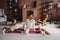 Beautiful young girl sitting relaxing on mat with candles in stylish cozy comfort home interior with comfy furniture