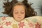 Beautiful young girl sleeping with wild hair