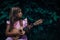 Beautiful young girl with ukulele