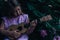 Beautiful young girl with ukulele