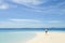 beautiful young girl walking on tropical beach