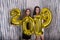 Beautiful young girls with golden 2019 balloons