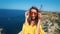 Beautiful young happy girl traveler with long wind blowing hair