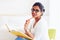 Beautiful young indian girl, student with book, studying