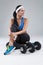 Beautiful young jogging woman exercises with dumbbells Isolated