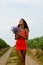 Beautiful young lady holding wildflowers and