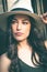 Beautiful young latino woman with panama hat portrait outdoor in