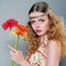 Beautiful young long-haired girl with flowers