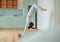 Beautiful young mixed race woman practicing yoga at home. Hispanic female doing pilates exercise as part of her workout