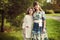 Beautiful young mother in a floral dress and daughter teen 10 ye