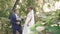 Beautiful young newlyweds outdoors in a summer park