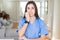 Beautiful young nurse woman wearing uniform and stethoscope at the clinic looking stressed and nervous with hands on mouth biting