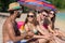 Beautiful young people are sunbathing on the beach.