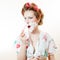 Beautiful young pinup woman shaving face with foam and razor