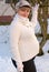 Beautiful young pregnant woman in snow garden