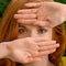 Beautiful young redhead woman hiding behind hands