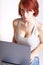 Beautiful young redhead woman sitting