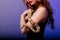 Beautiful young redhead woman with a snake with a fashionable perfect makeup. Studio shot