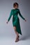 Beautiful young sexy woman thin slim figure evening makeup fashionable stylish dress clothing collection, brunette, green silk