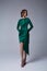 Beautiful young sexy woman thin slim figure evening makeup fashionable stylish dress clothing collection, brunette, green silk
