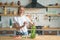 Beautiful young smiling woman making salad in the kitchen. Healthy food. vegetable salad. Diet. Healthy lifestyle. cooking at home