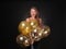 Beautiful young woman with balloons on dark background