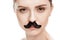 Beautiful young woman with black mustaches looking at camera