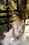 Beautiful young woman bride in luxurious wedding dress and dia