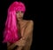A beautiful young woman in a bright pink wig
