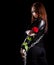 Beautiful young woman with chains and a red rose