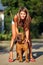 Beautiful young woman with Chinese Shar Pei dog