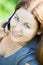 Beautiful young woman close-up portrait speaking on phone