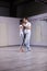 Beautiful young woman dancing kizomba with her partner.