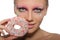 Beautiful young woman with donut in mouth