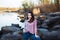 Beautiful young woman. Dramatic outdoor portrait of sensual brunette female with long hair. Sad and serious girl.